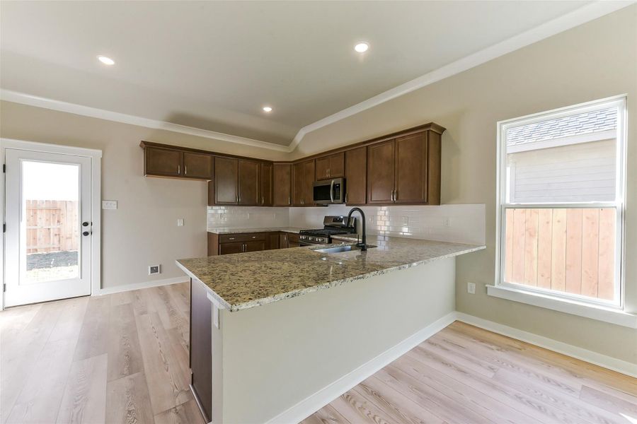 Furnished interior view inside a new home in Aldeana, Bonney (Image 13).