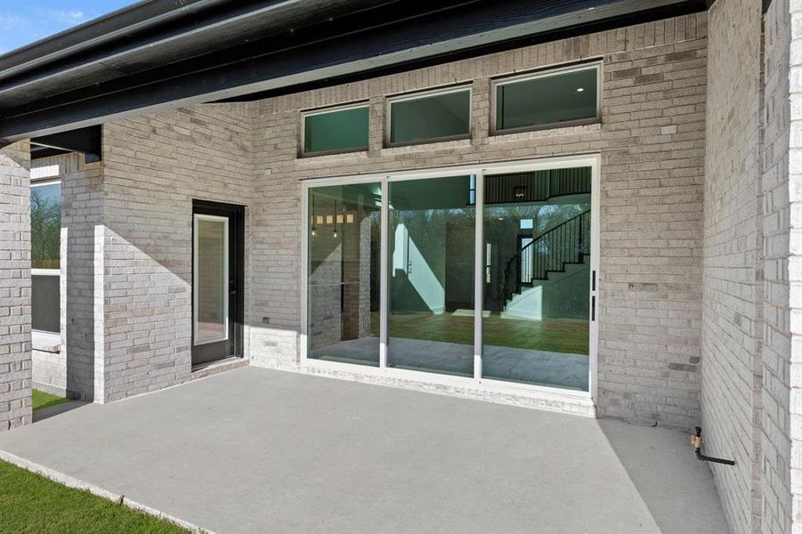 Exterior details and patio area of a home in Valencia on The Lake, Little Elm (Image 3).