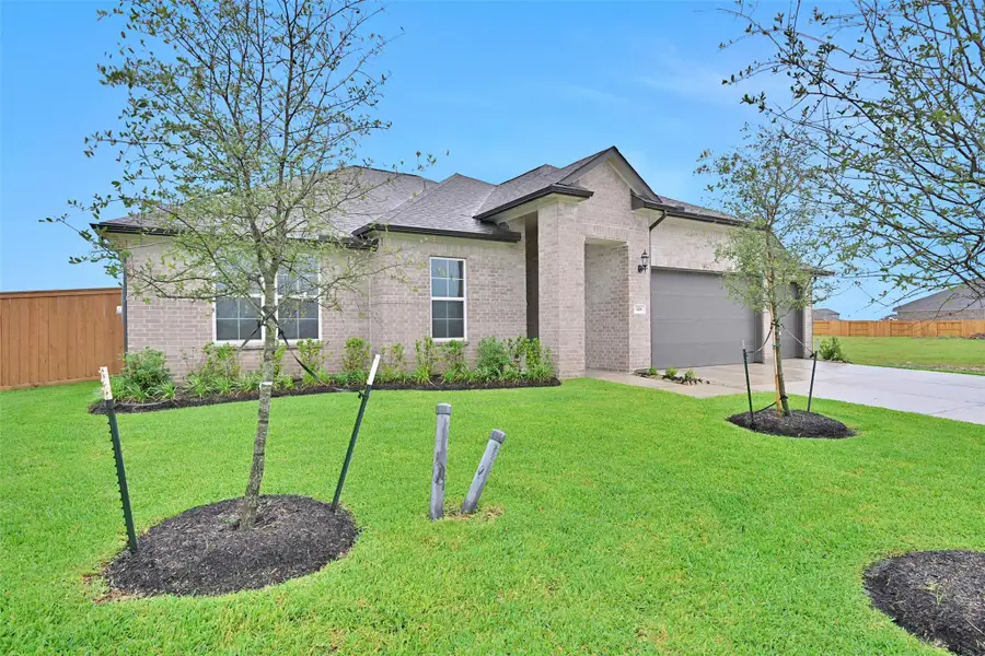 Front exterior of a new home in Lago Mar, Texas City, TX, highlighting curb appeal (Image 2).