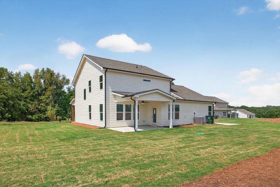 Front exterior of a new home in Magnolia Ridge, Monroe, GA, highlighting curb appeal (Image 1).