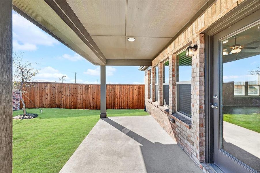 Exterior details and patio area of a home in Mobberly Farms, Pilot Point (Image 20). Exterior details and patio area of a home in Mobberly Farms, Pilot Point (Image 20).
