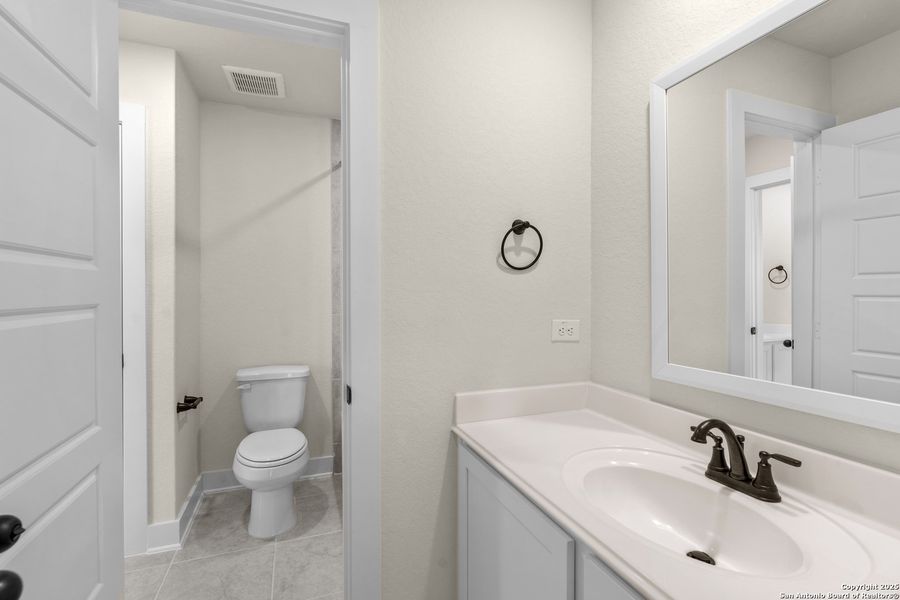 Furnished interior view inside a new home in Hunters Ranch, San Antonio (Image 36).