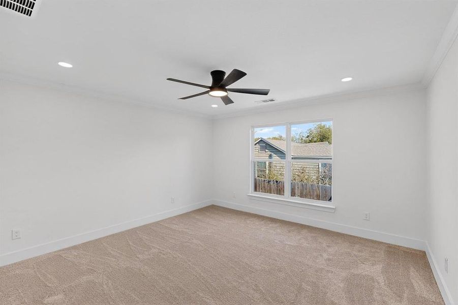 Unfurnished room with ornamental molding, light carpet, recessed lighting, and ceiling fan