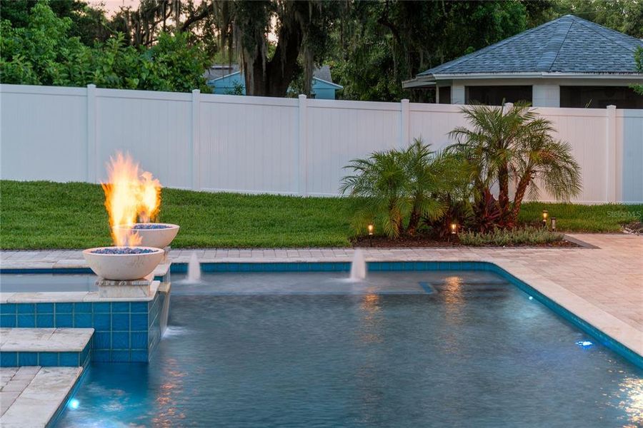 Heated pebbletec saltwater pool with spa, sunshelf with water feature, variable speed high efficiency pump, and 2 gas fireballs Heated pebbletec saltwater pool with spa, sunshelf with water feature, variable speed high efficiency pump, and 2 gas fireballs