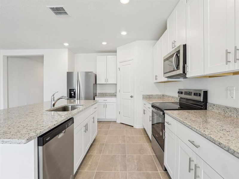 Furnished interior view inside a new home in The Reserve at Van Oaks, Auburndale (Image 10).