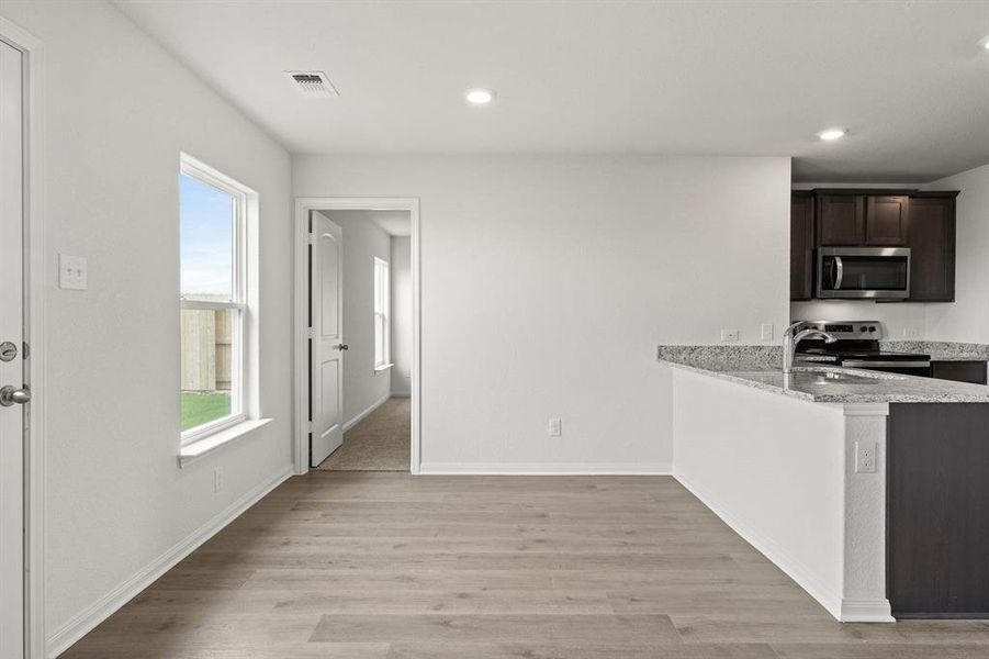 Furnished interior view inside a new home in Retreat at Fossil Creek, Fort Worth (Image 3).