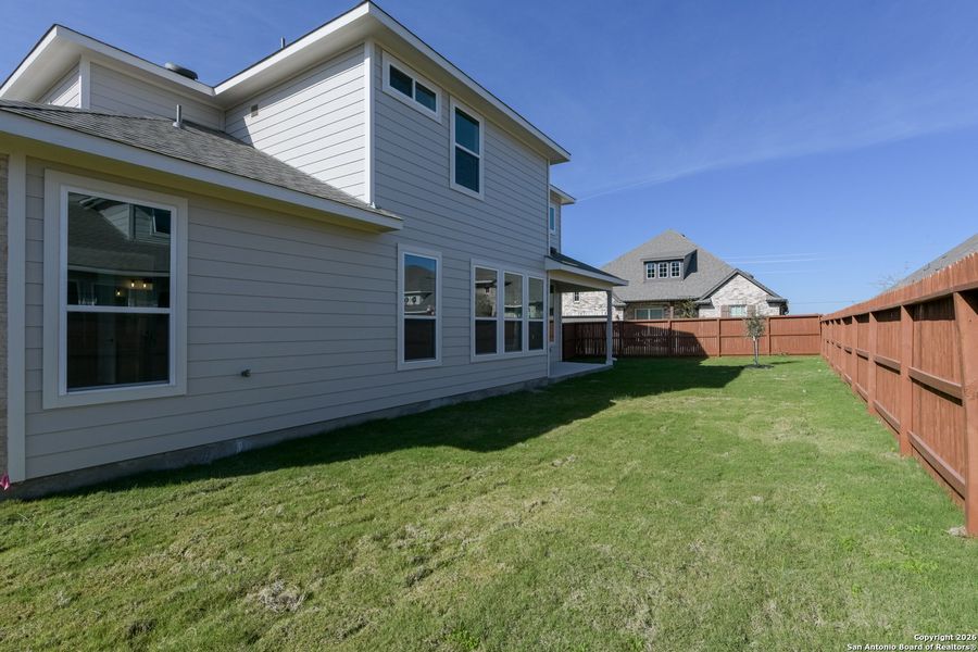 Exterior details and patio area of a home in Megan's Landing 70's, Castroville (Image 4).