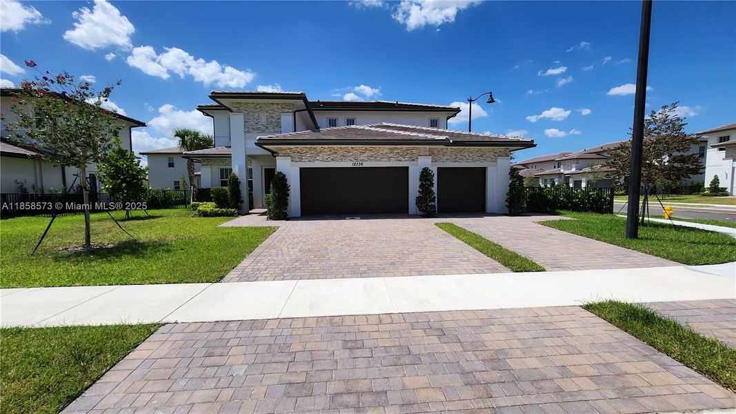 Front exterior of a new home in , Davie, FL, highlighting curb appeal (Image 20).