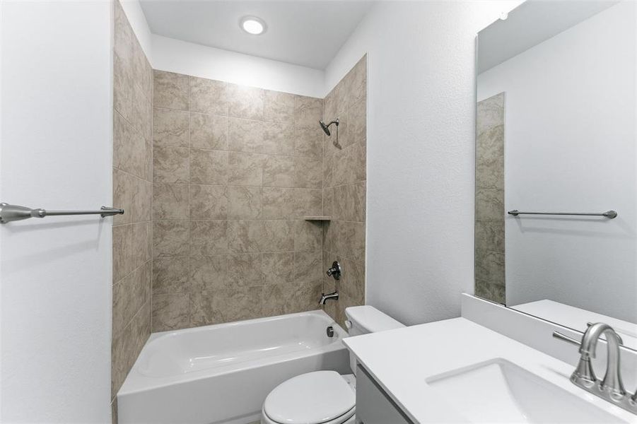 Full bath featuring bathing tub / shower combination and vanity