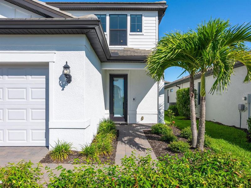 Front exterior of a new home in , Lakewood Ranch, FL, highlighting curb appeal (Image 26).