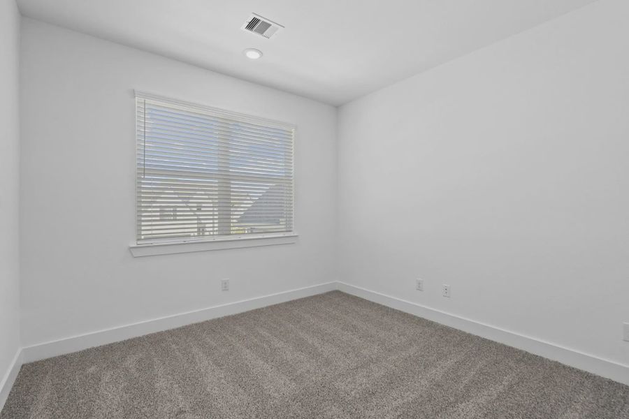Representative unfurnished interior of a home built from the Waterford by Chesmar Homes in Meridiana 60's, Manvel (Image 40).