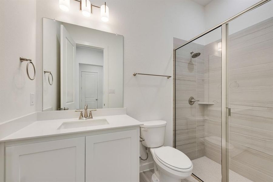 Full bathroom with a shower stall and vanity Full bathroom with a shower stall and vanity