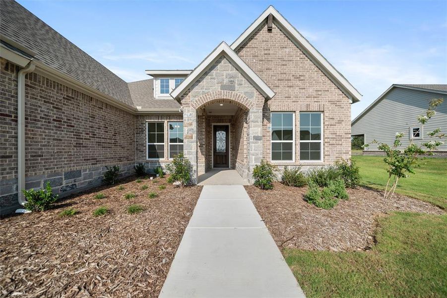 Front exterior of a new home in Fairview Meadows, New Fairview, TX, highlighting curb appeal (Image 21). Front exterior of a new home in Fairview Meadows, New Fairview, TX, highlighting curb appeal (Image 21).