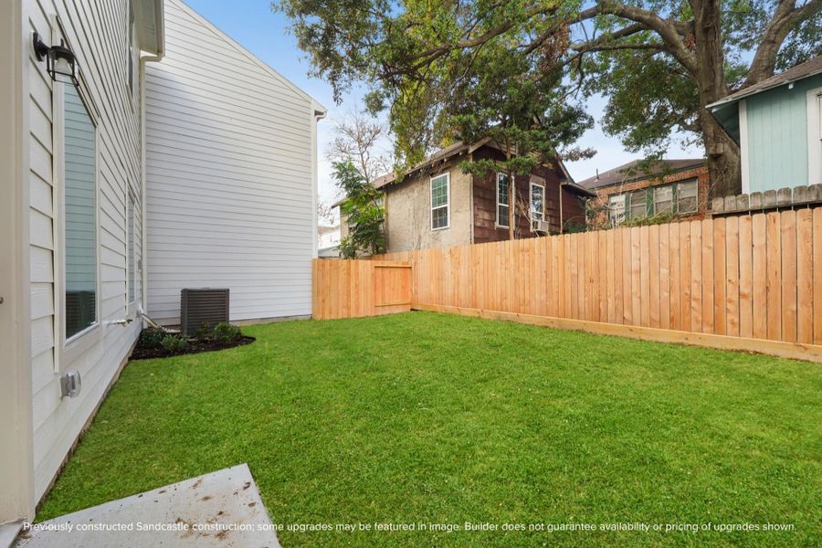 A rare inner-loop luxury: a private fenced backyard with room to relax, garden, or play fetch with your pup.