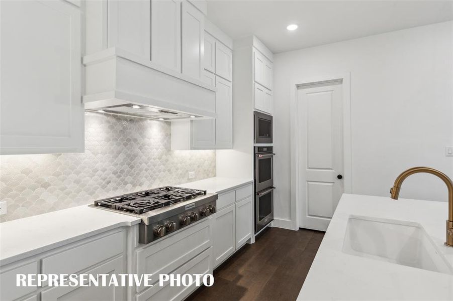 Complete with beautiful cabinetry, gorgeous countertops, designer backsplsh and modern stainless steel, any chef would be proud to call this kitchen their own!  REPRESENTATIVE PHOTO