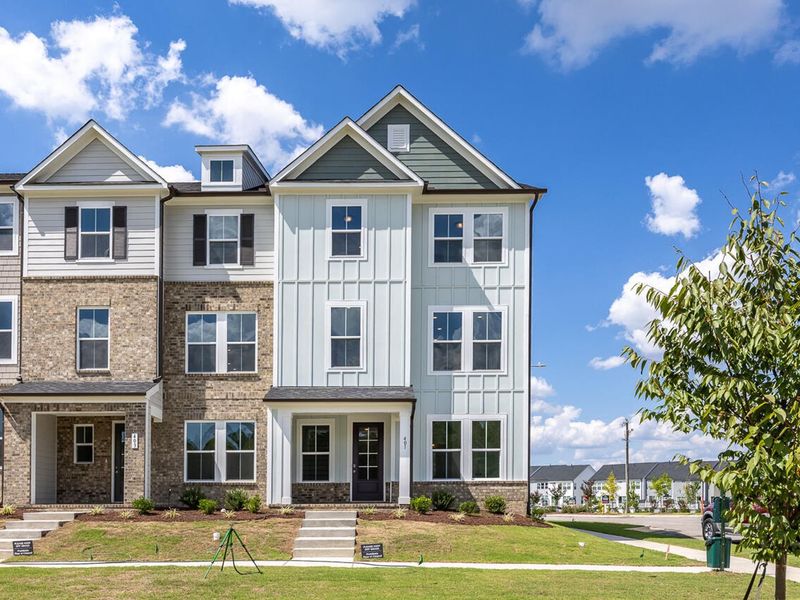 Front exterior of a new home in Forestville Yard Townhomes, Knightdale, NC, highlighting curb appeal (Image 2). Front exterior of a new home in Forestville Yard Townhomes, Knightdale, NC, highlighting curb appeal (Image 2).