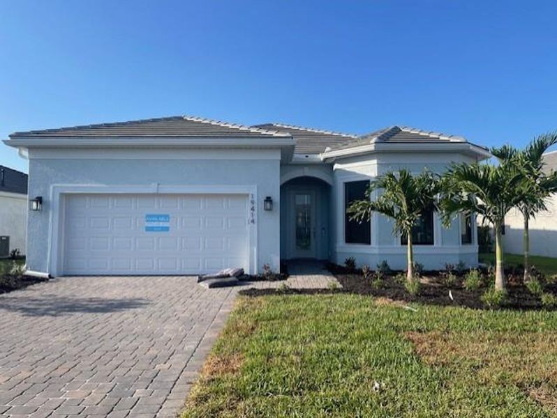 Front exterior of a new home in Del Webb Catalina, Lakewood Ranch, FL, highlighting curb appeal (Image 1).