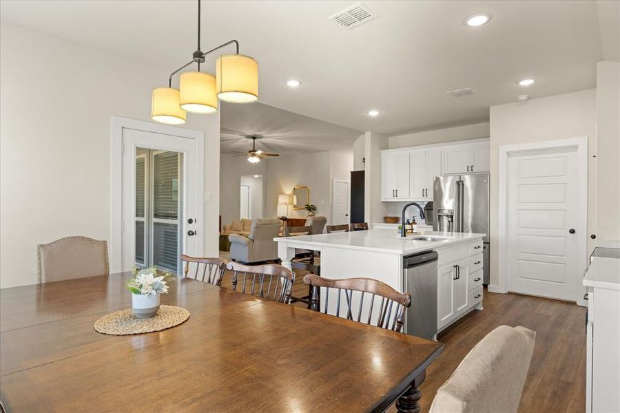 Dining space featuring dark wood-style floors, recessed lighting, and ceiling fan
