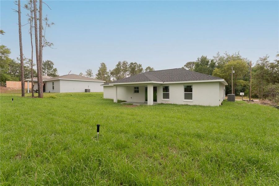 Exterior details and patio area of a home in , Citrus Springs (Image 25).