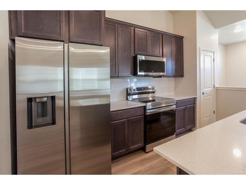 Furnished interior view inside a new home in Raindance Condos, Windsor (Image 6).