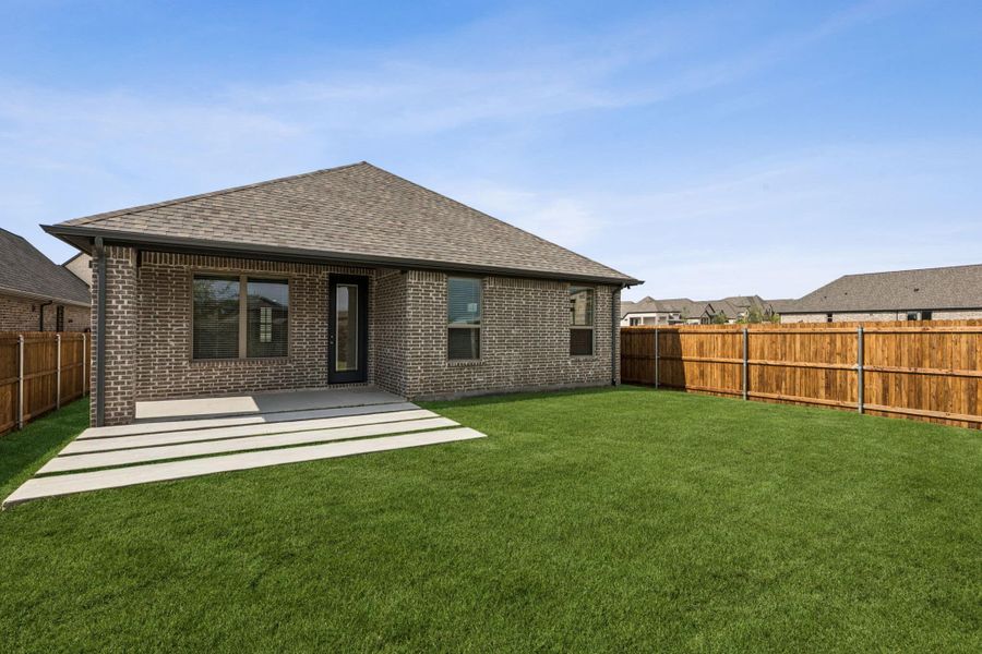 Front exterior of a new home in Avondale, Fate, TX, highlighting curb appeal (Image 2).