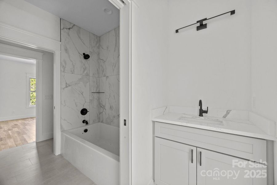 Hall bath adjoins bedrooms 2 and 3 Hall bath adjoins bedrooms 2 and 3