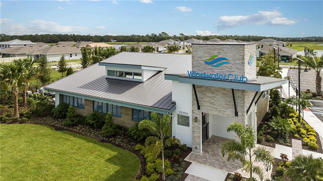 Front exterior of a new home in Windwater, Parrish, FL, highlighting curb appeal (Image 1).