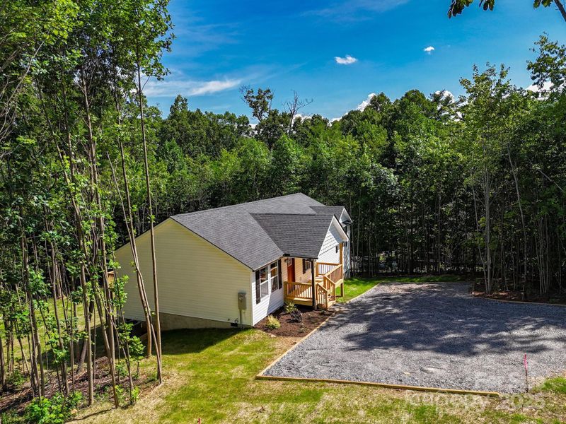 Front exterior of a new home in , Candler, NC, highlighting curb appeal (Image 2). Front exterior of a new home in , Candler, NC, highlighting curb appeal (Image 2).