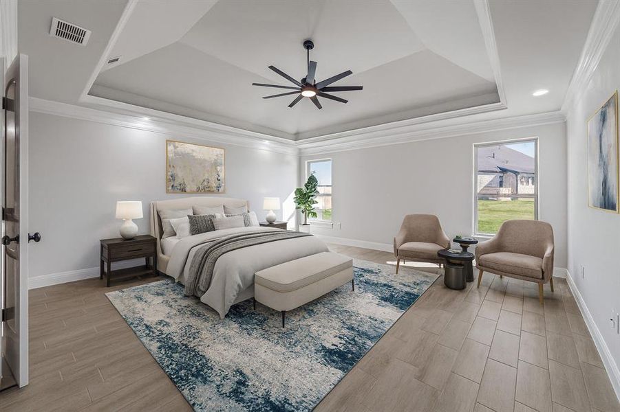 Bedroom with a raised ceiling, wood tiled floors, crown molding, multiple windows, and ceiling fan