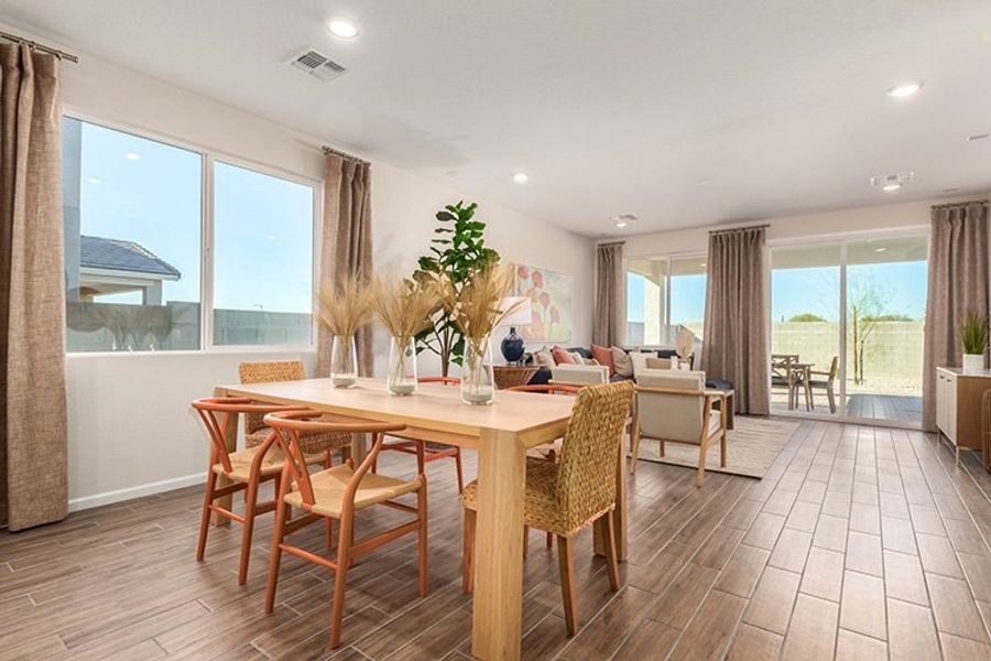 A room with a table and chairs. A room with a table and chairs.