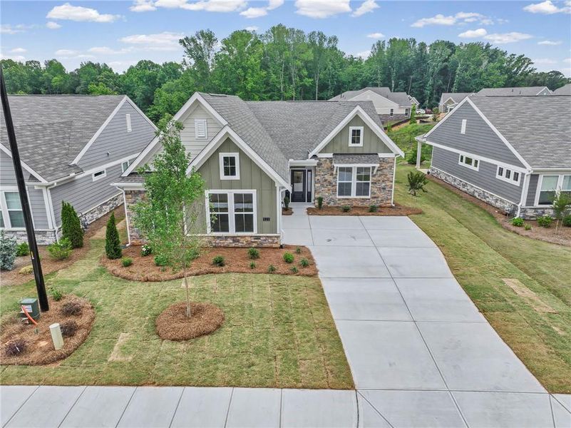 Front exterior of a new home in Laurel Farms, Dallas, GA, highlighting curb appeal (Image 17). Front exterior of a new home in Laurel Farms, Dallas, GA, highlighting curb appeal (Image 17).