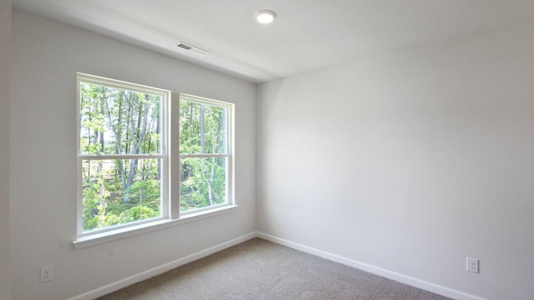 Spacious, unfurnished interior of a new home in Copper Run South, Durham (Image 21).