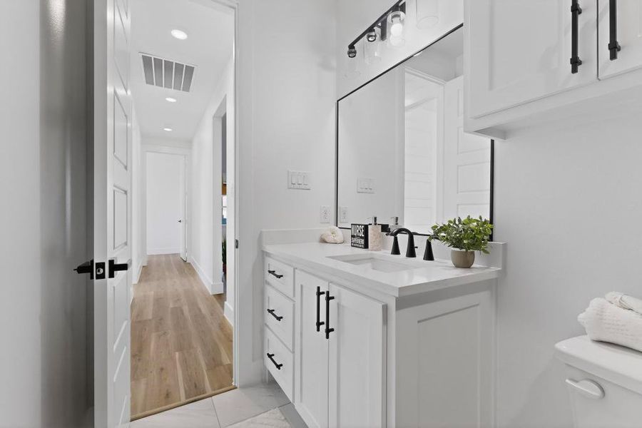 Half bath featuring vanity and recessed lighting Half bath featuring vanity and recessed lighting