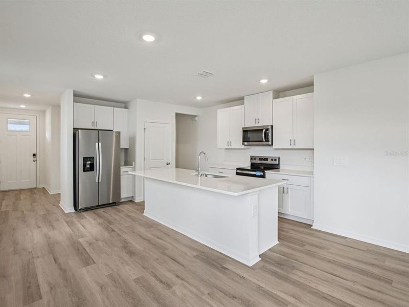 Furnished interior view inside a new home in The Grove at Stuart Crossing - Premier Series, Bartow (Image 6).