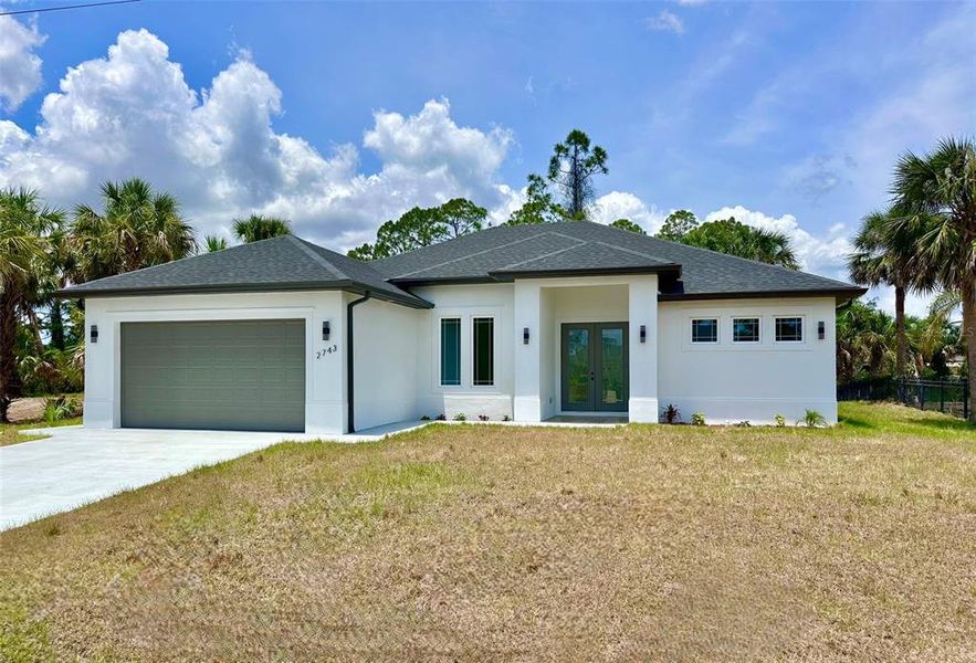 Front exterior of a new home in , North Port, FL, highlighting curb appeal (Image 2).