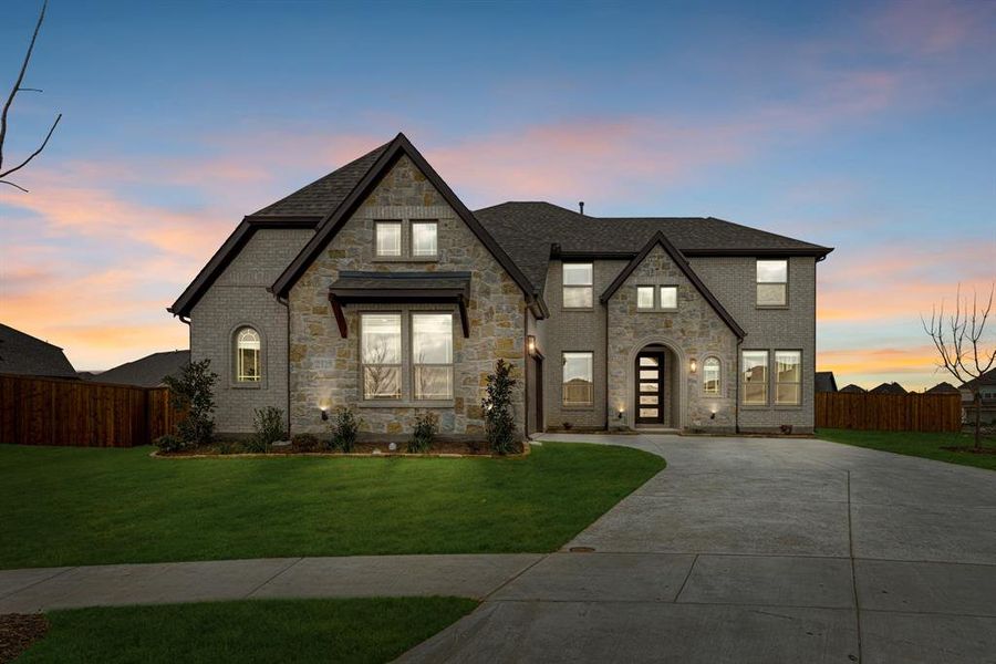 Front exterior of a new home in ArrowBrooke, Aubrey, TX, highlighting curb appeal (Image 26). Front exterior of a new home in ArrowBrooke, Aubrey, TX, highlighting curb appeal (Image 26).
