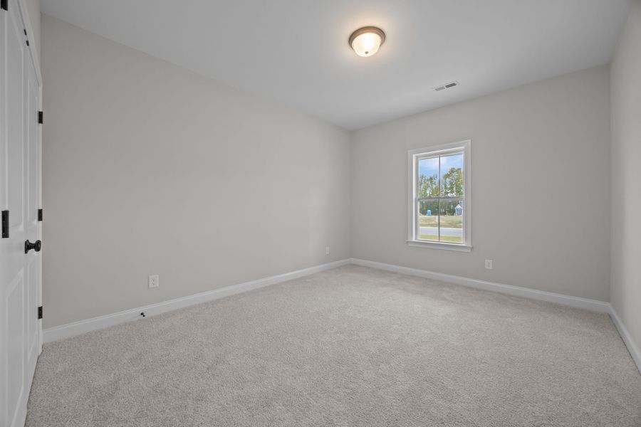 Spacious, unfurnished interior of a new home in The Preserve at Langston, Winterville (Image 49).