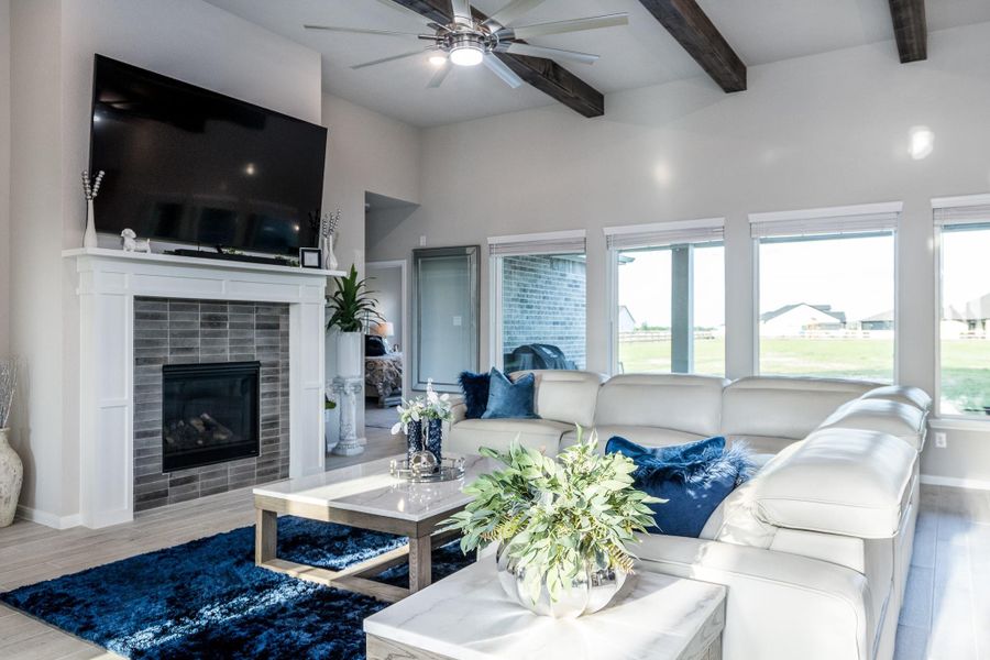 Great room with well appointed designer Fireplace and gas logs