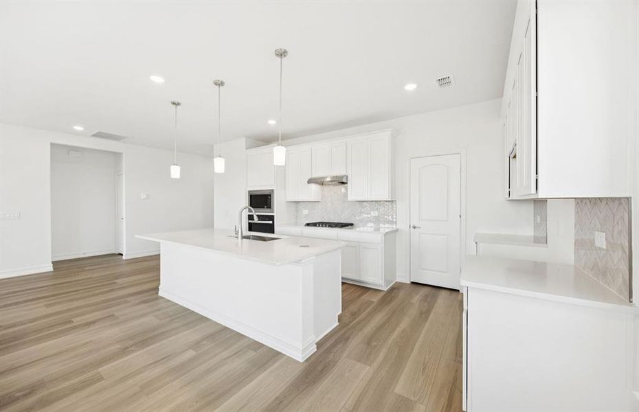 Spacious kitchen with eat-in bartop island