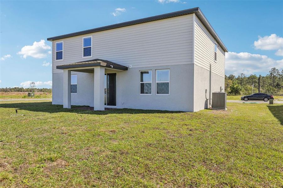 Exterior details and patio area of a home in Lake Deer Estates - Signature Series, Poinciana (Image 25). Exterior details and patio area of a home in Lake Deer Estates - Signature Series, Poinciana (Image 25).