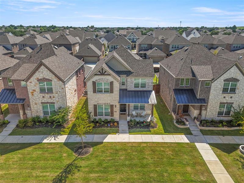 Front exterior of a new home in Merritt Village, Rowlett, TX, highlighting curb appeal (Image 20).