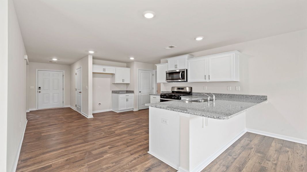 Furnished interior view inside a new home in Bentley Park, Greenwood (Image 9).