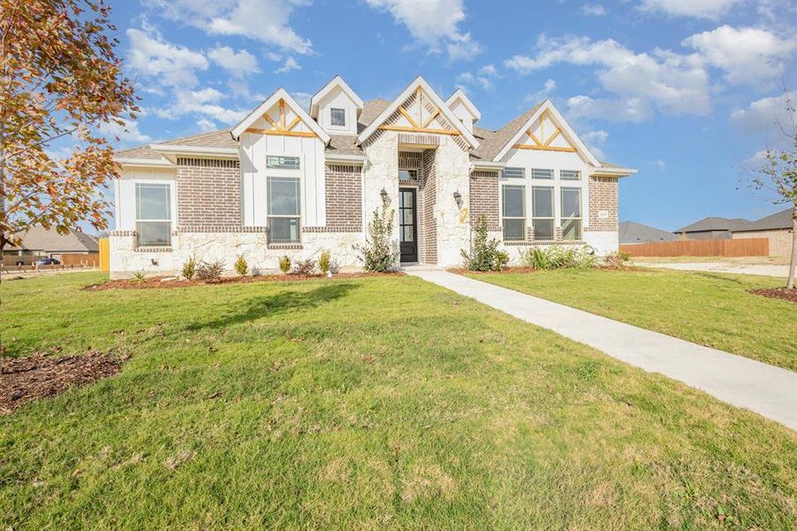 Front exterior of a new home in Ten Mile Creek Estates, DeSoto, TX, highlighting curb appeal (Image 20).