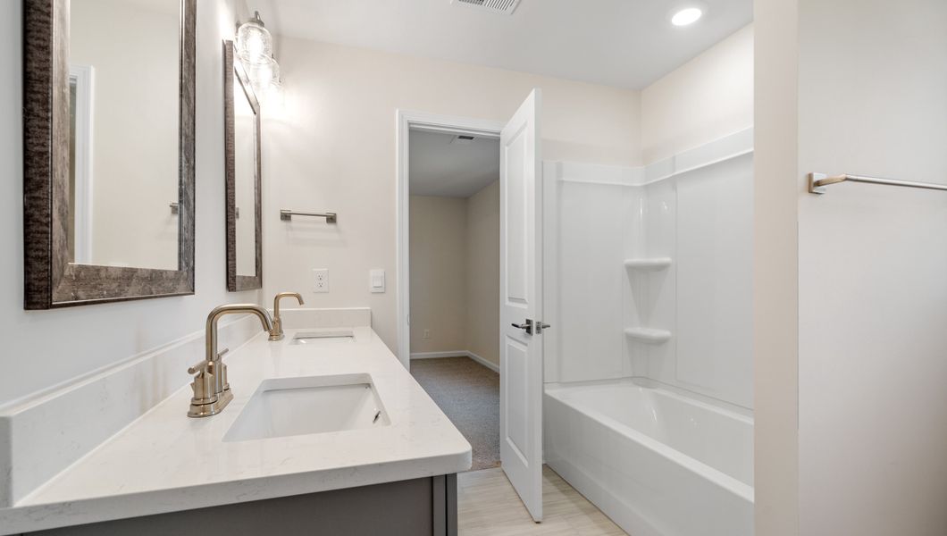 Representative furnished interior of a home built from the LONDON by D.R. Horton in Adams Glen, Greenville (Image 11).