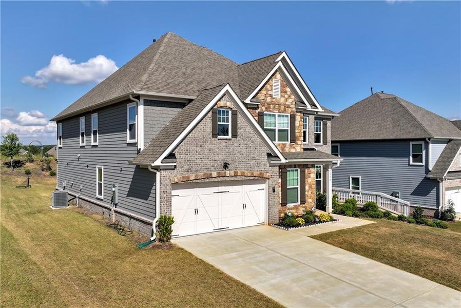 Front exterior of a new home in , Cumming, GA, highlighting curb appeal (Image 30).