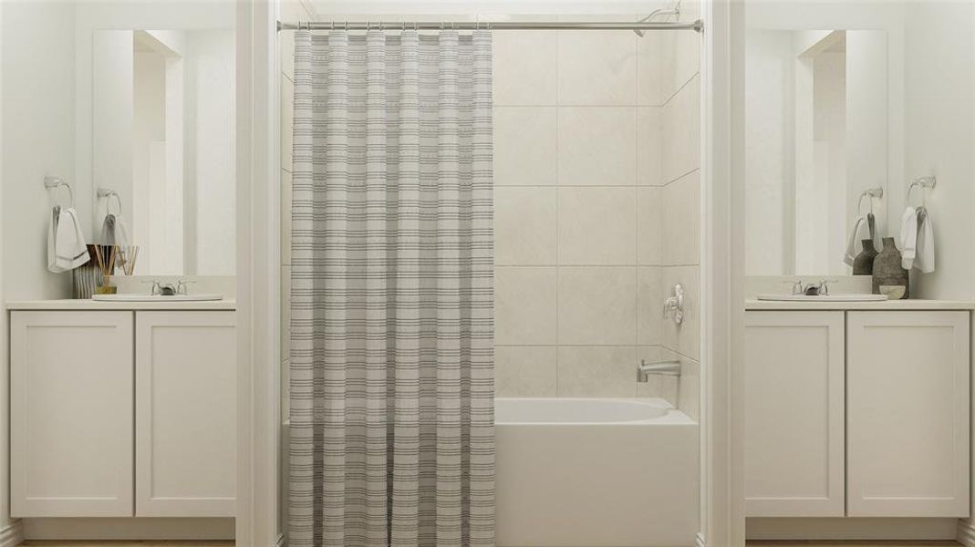 Bathroom featuring vanity and shower / bath combo with shower curtain