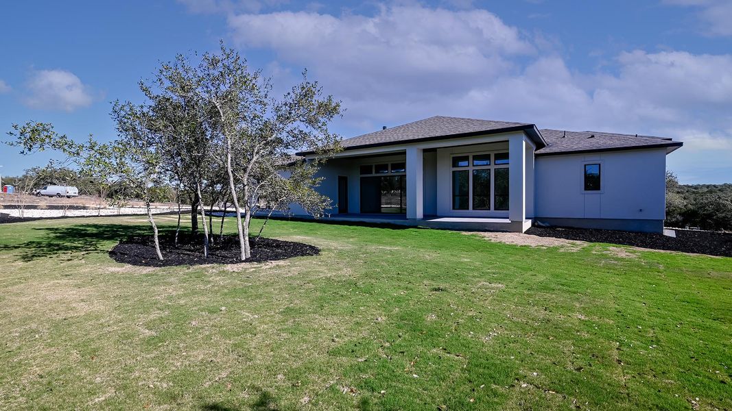 Exterior details and patio area of a home in The Preserve at Elm Creek, New Braunfels (Image 18).
