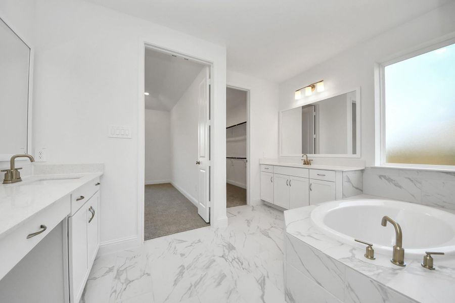 Furnished interior view inside a new home in ARTAVIA, Conroe (Image 13).