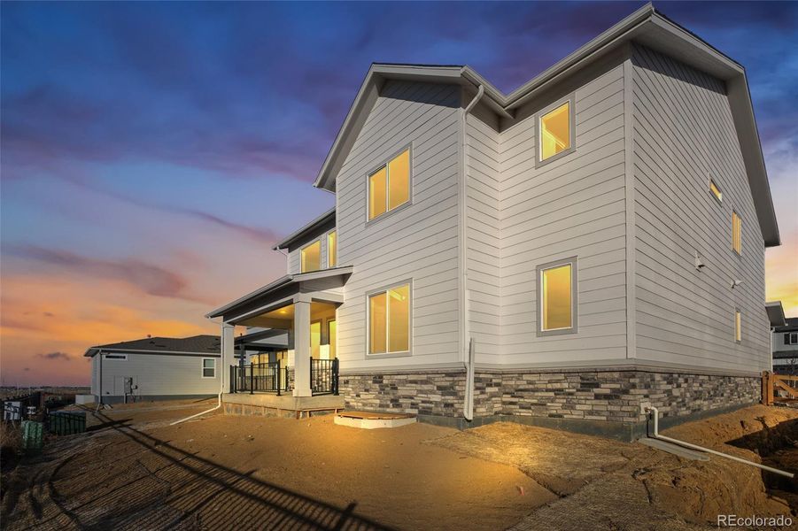 Exterior details and patio area of a home in Harvest Crossing, Aurora (Image 21).