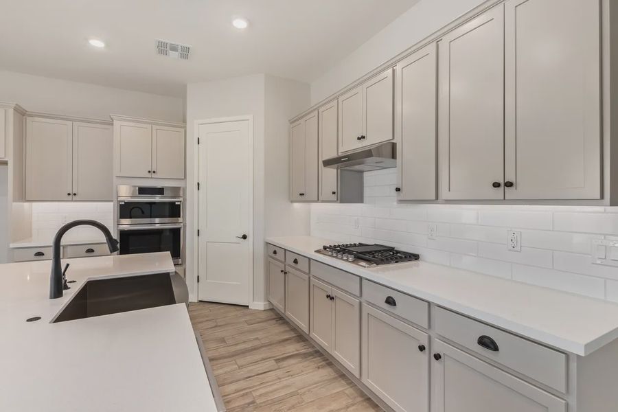 Furnished interior view inside a new home in Valencia at Granite Vista, Waddell (Image 8).
